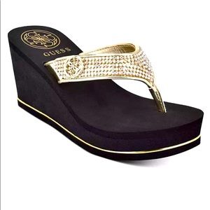 New in box GUESS black and gold wedge flip flops size 6